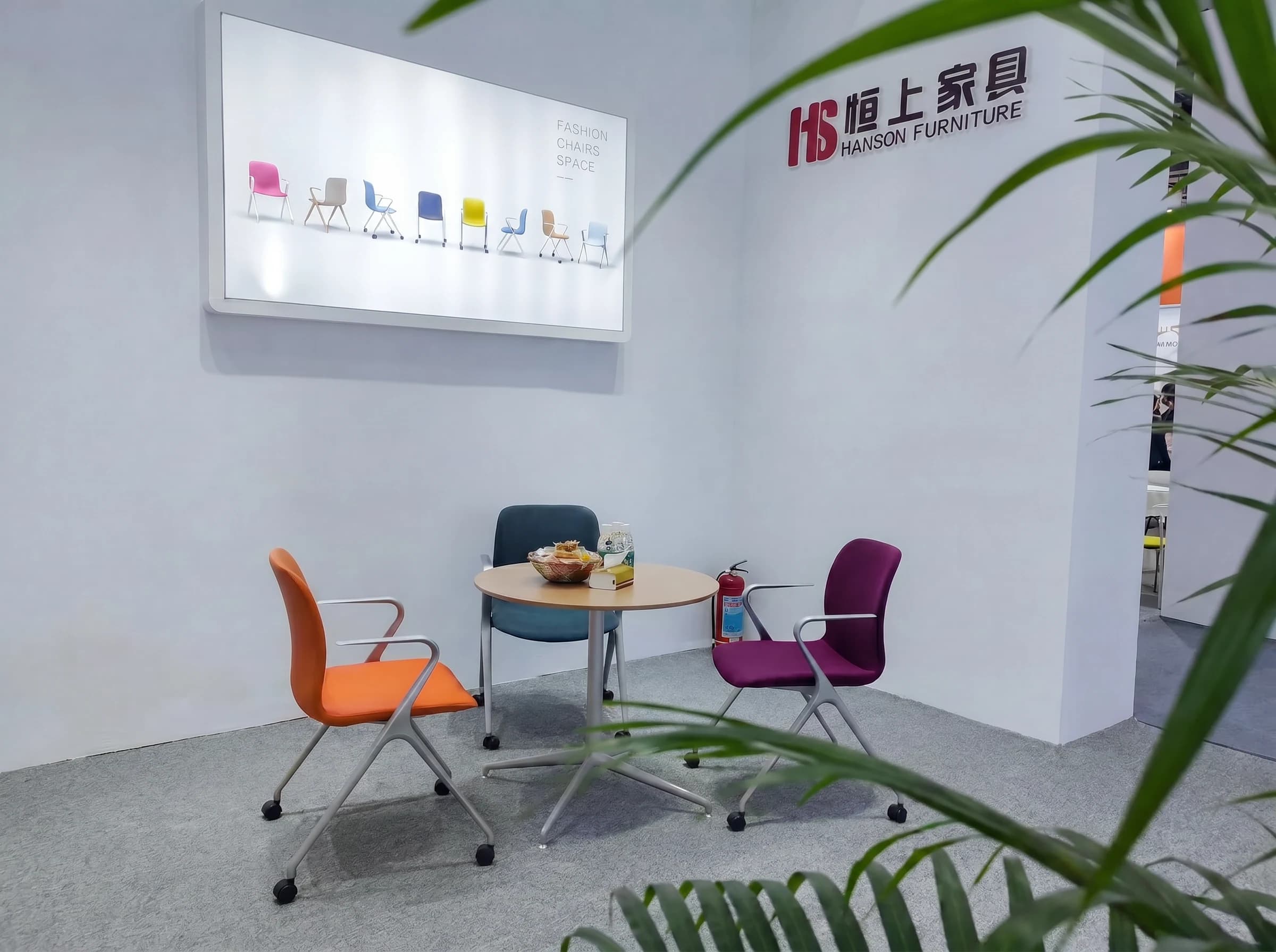 Table and chair setting for discussions at the Hanson Furniture booth