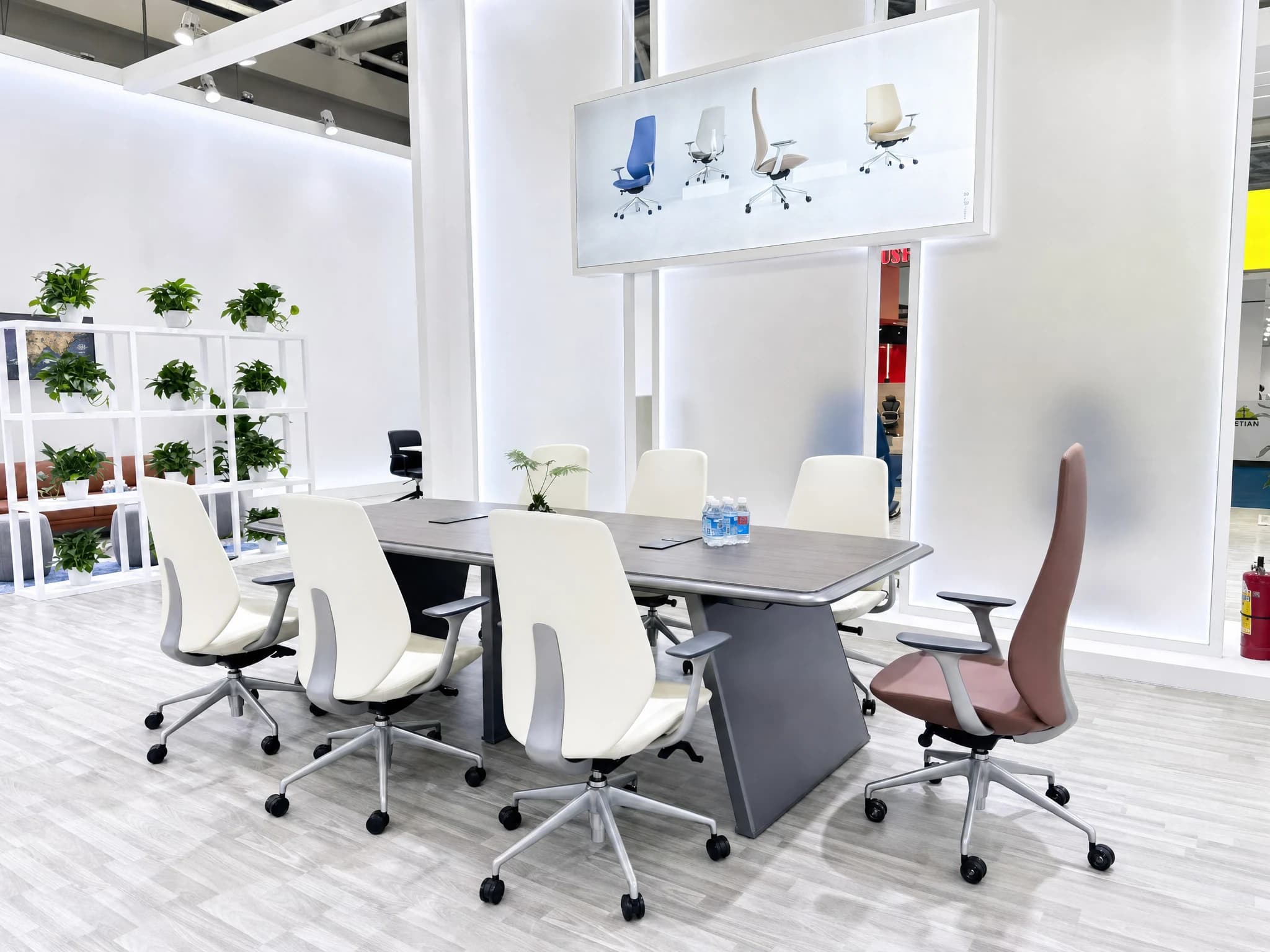 Meeting chairs arranged around tables in the Hanson Furniture booth