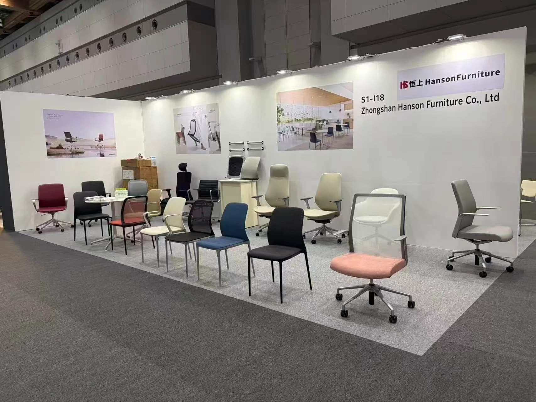 Hanson Furniture booth with multiple chair series at ORGATEC TOKYO 2026
